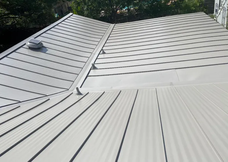 Solar attic fan installed on a metal roof for Roof Ventilation in North Salt Lake